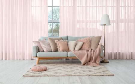 Grey,Sofa,With,Soft,Pillows,And,Lamp,Near,Big,Window